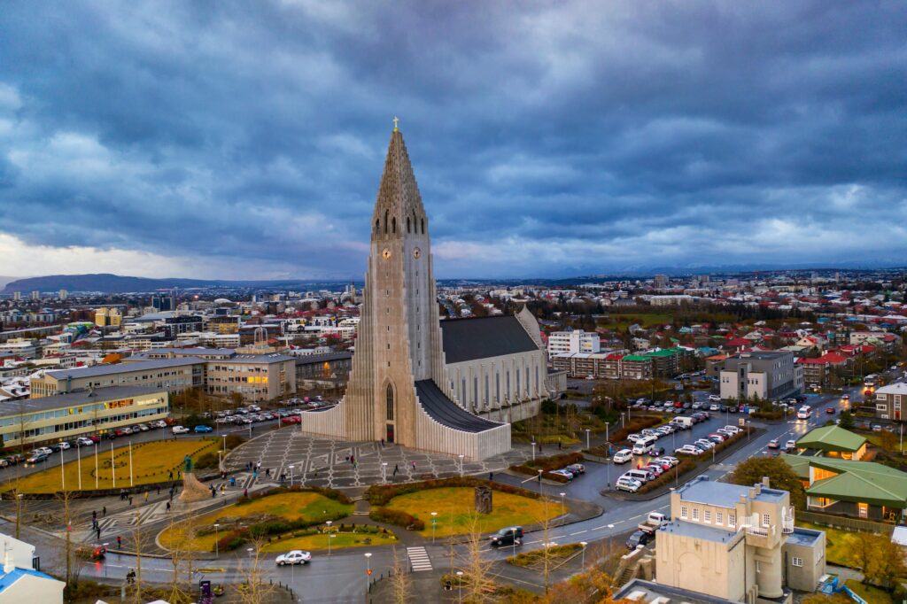A stunning aerial view of Hallgrímskirkja and the cityscape of Reykjavik, Iceland at daytime.
